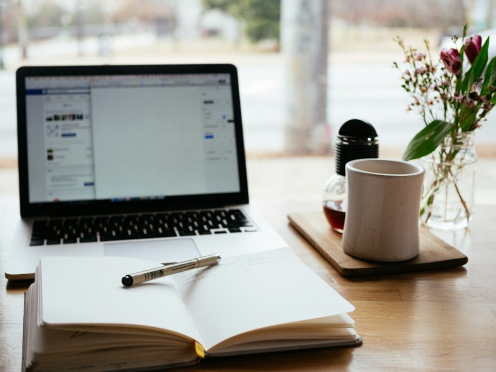 Laptop and notepad on a desk