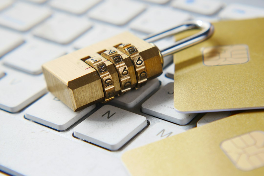 Golden padlock resting on a laptop keyboard